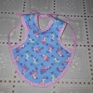 Reversible baby bib for your little baby girl.